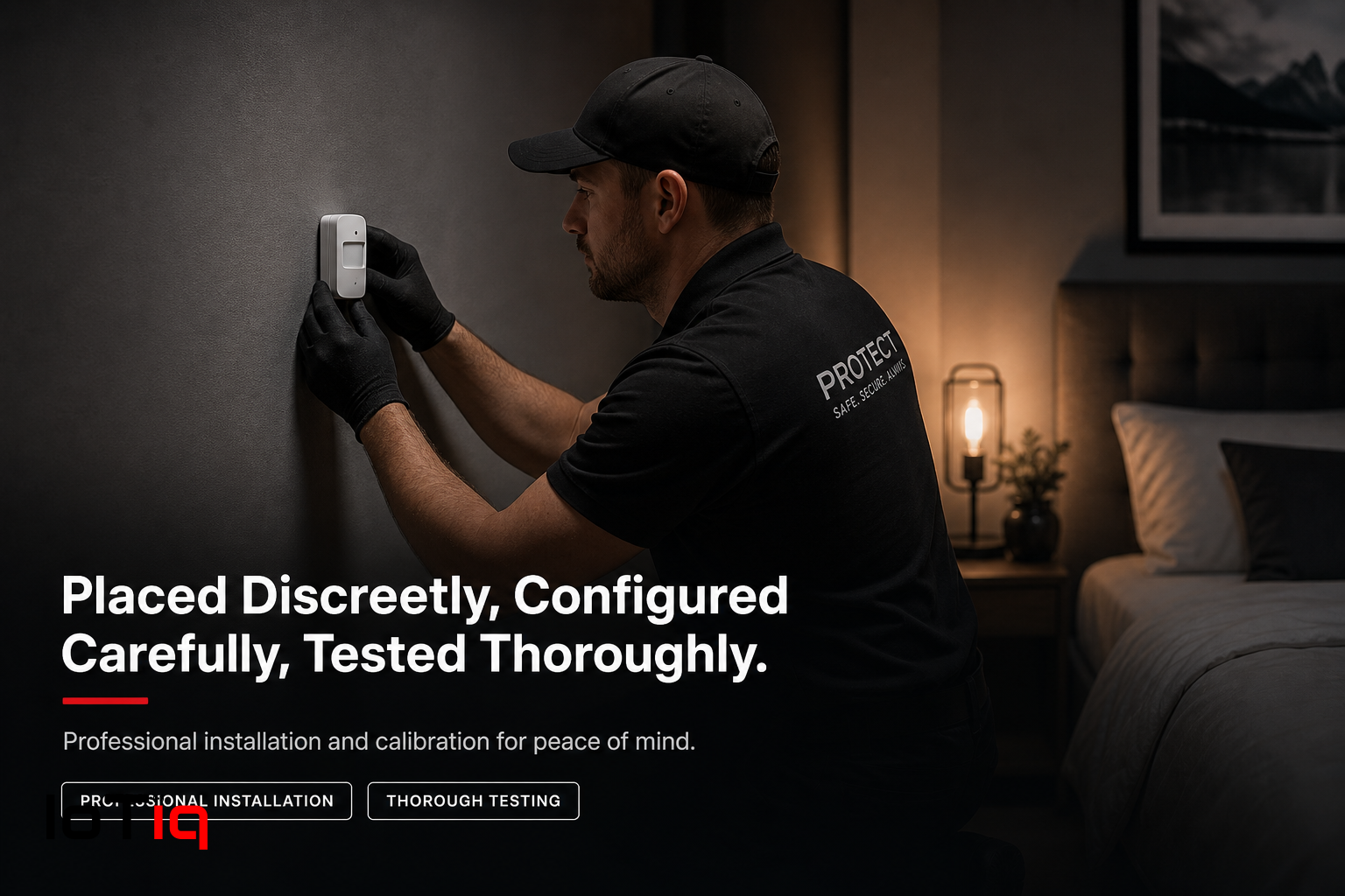 Technician installing IoTiq fall detection sensor in a bedroom